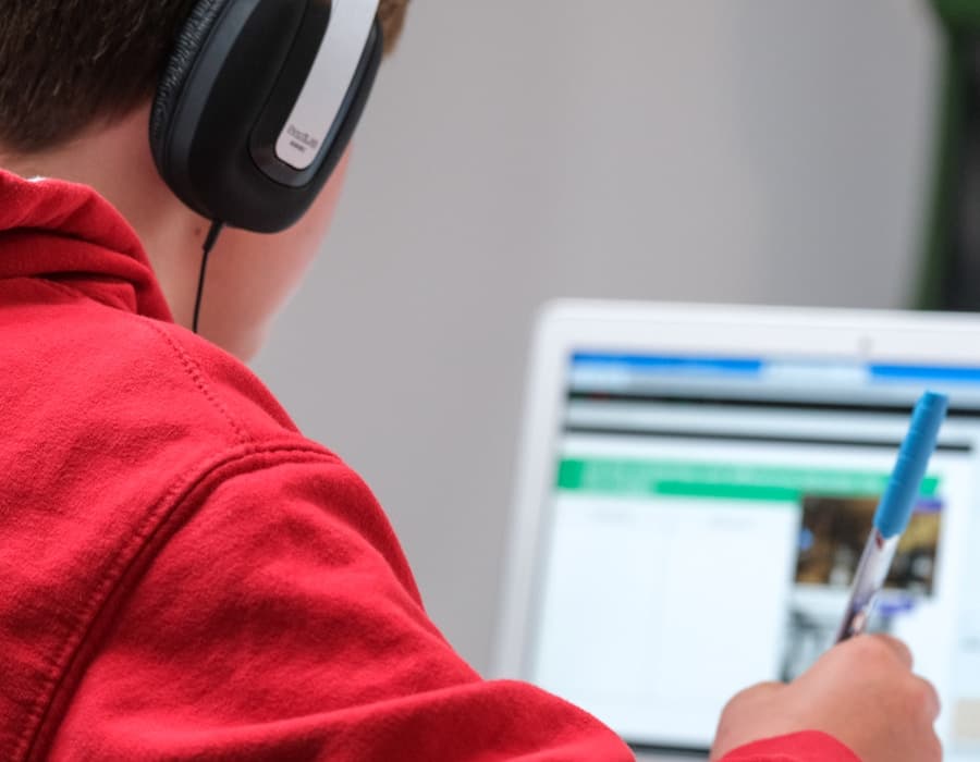 Student in an online tutoring session on a laptop